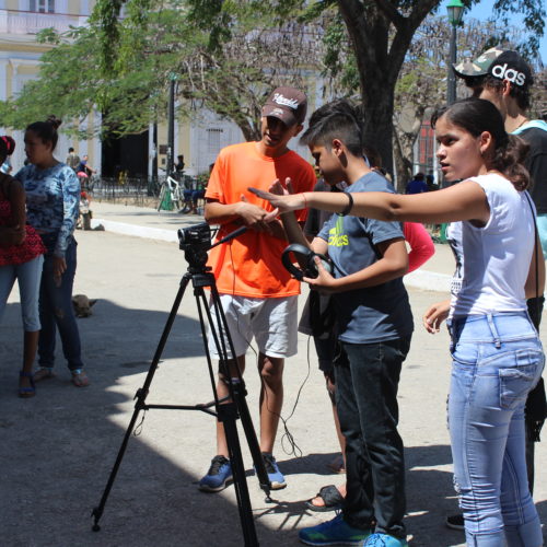 Group of young people filming in Cuba