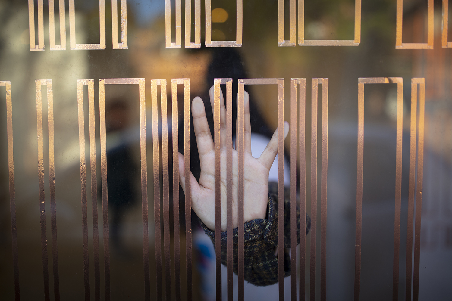 Continuity, Nadya Monfrinoli and Robin Williamson at Frequency Festival 2019. Photo credit Electric Egg hand touching window from inside with copper tape on window